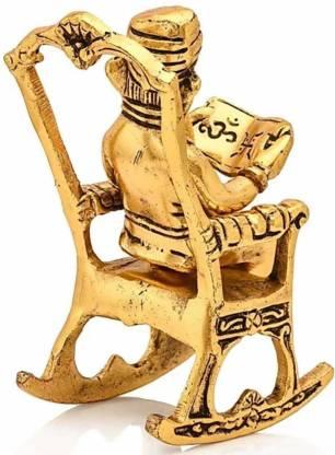 Golden Ganesha Showpiece – Lord Ganesha on Rocking Chair Reading Ramayan