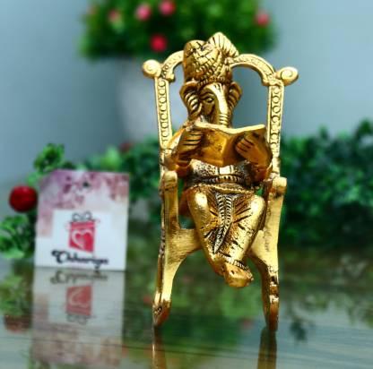 Golden Ganesha Showpiece – Lord Ganesha on Rocking Chair Reading Ramayan