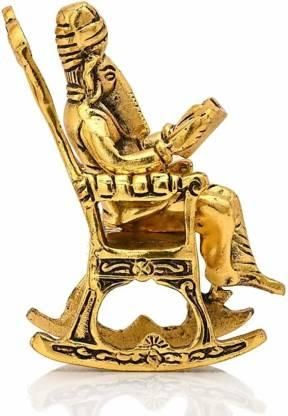 Golden Ganesha Showpiece – Lord Ganesha on Rocking Chair Reading Ramayan